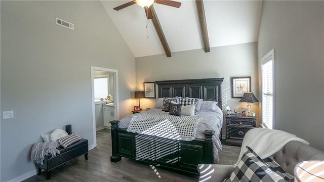 bedroom featuring dark hardwood / wood-style floors, high vaulted ceiling, ensuite bath, ceiling fan, and beam ceiling