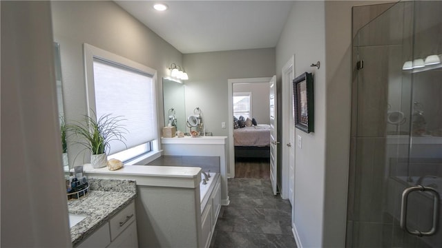 bathroom featuring vanity and a shower with shower door