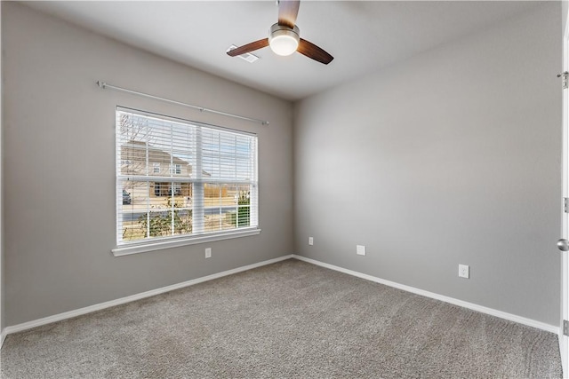 carpeted empty room with ceiling fan