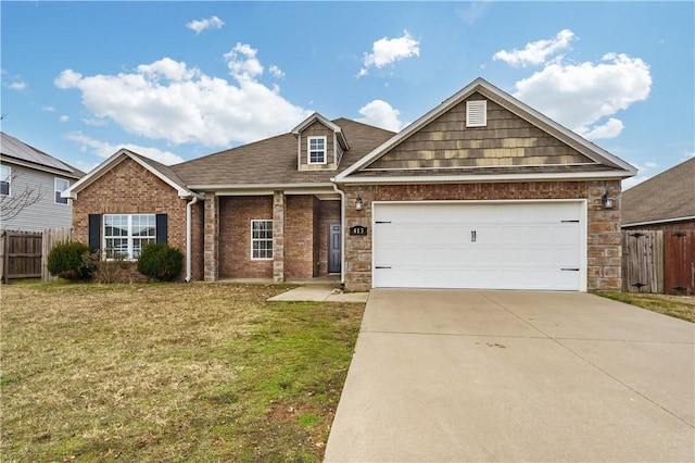 view of front facade with a front yard and a garage