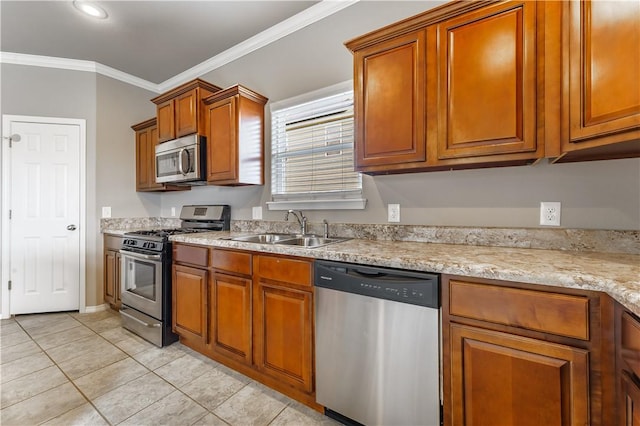 kitchen featuring stainless steel appliances, light tile patterned flooring, light stone countertops, crown molding, and sink