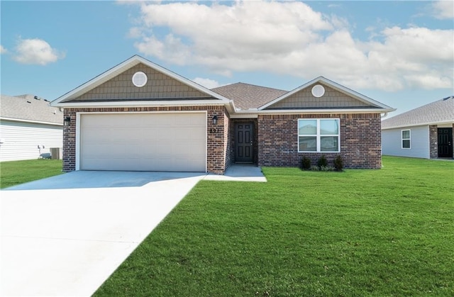 view of front of home with central AC, a garage, and a front lawn