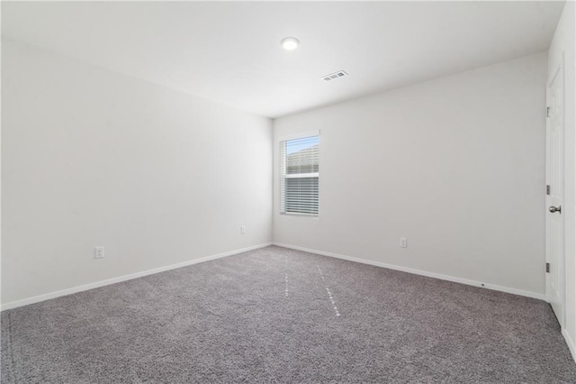 empty room featuring carpet floors