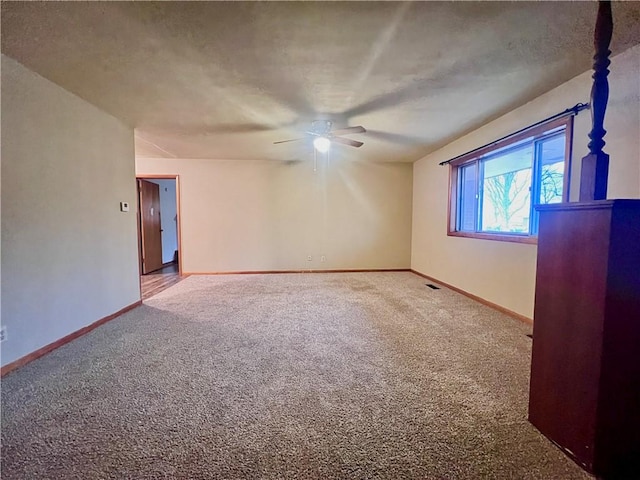 spare room with ceiling fan, lofted ceiling, and carpet floors