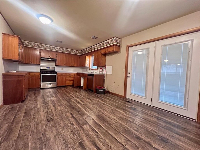 kitchen with stainless steel dishwasher, range, and dark hardwood / wood-style floors