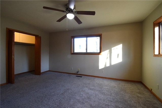 unfurnished bedroom featuring ceiling fan, carpet flooring, and a closet