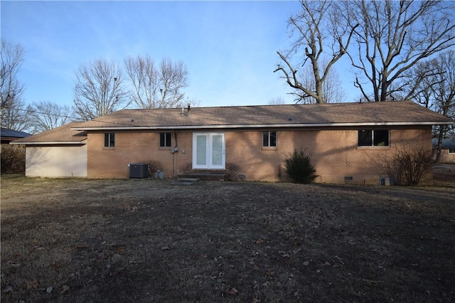 back of property with french doors and central AC unit