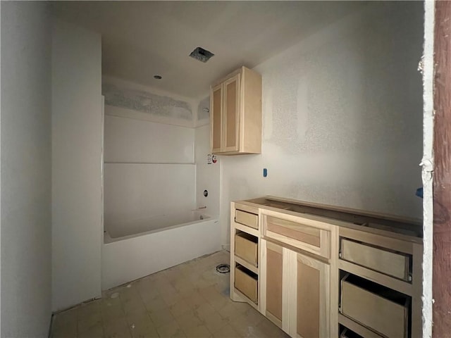 interior space featuring light brown cabinetry