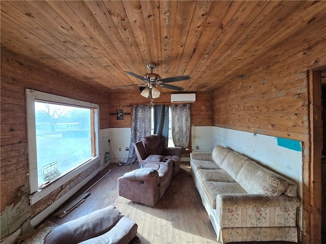 unfurnished living room featuring wood ceiling, wooden walls, dark wood-type flooring, ceiling fan, and a wall mounted AC