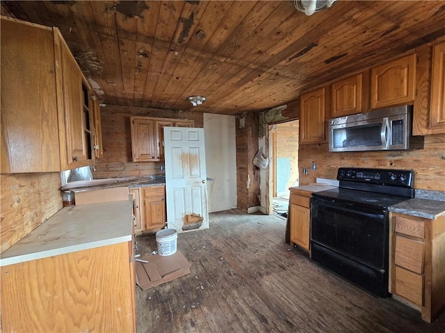 kitchen featuring wooden ceiling, dark hardwood / wood-style flooring, wooden walls, and black electric range