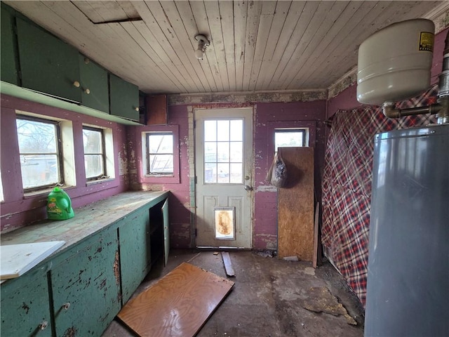 interior space featuring wooden ceiling and gas water heater