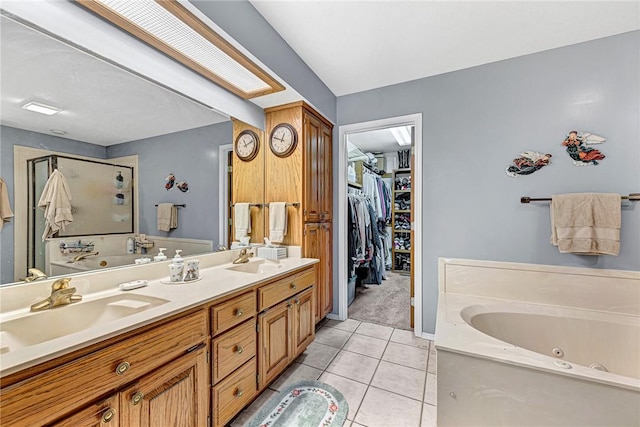 bathroom with vanity, tile patterned floors, and plus walk in shower