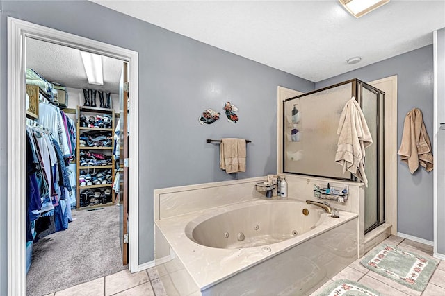 bathroom featuring separate shower and tub, a textured ceiling, and tile patterned flooring