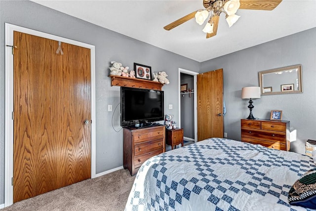 carpeted bedroom with a closet and ceiling fan