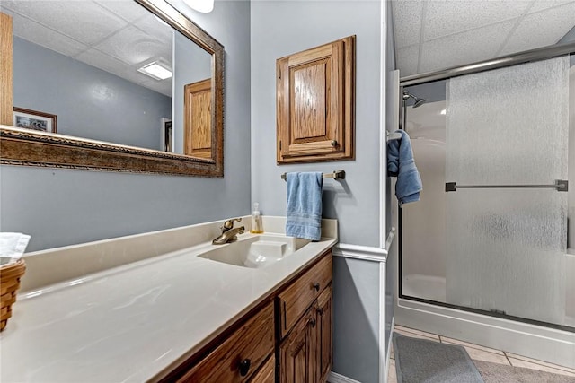 bathroom featuring vanity, walk in shower, and tile patterned floors