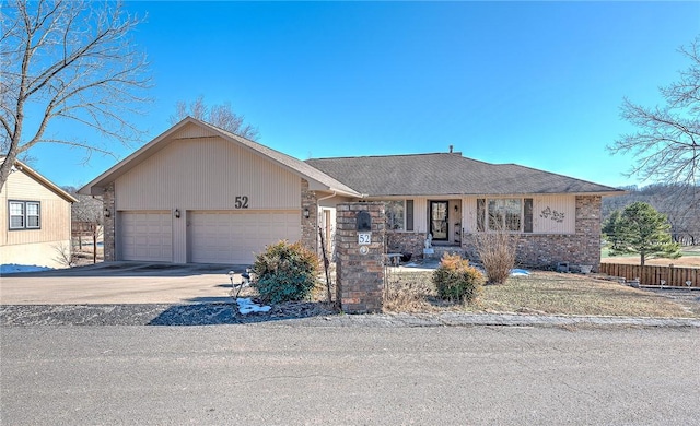 ranch-style house featuring a garage