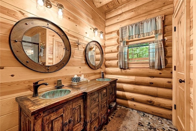 bathroom featuring vanity and log walls