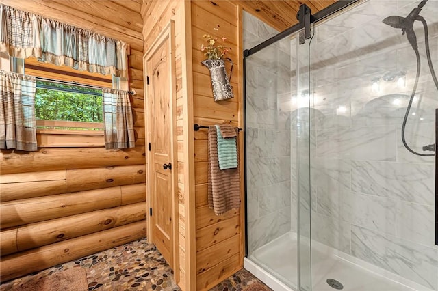 bathroom featuring a shower with shower door, log walls, and wood ceiling