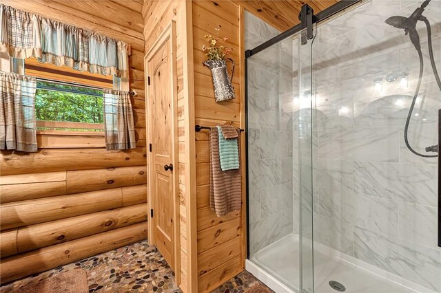 170 Meadow Ridge Rd, Eureka Springs, AR 72632 - bathroom featuring a stall shower, log walls, and stone finish floors