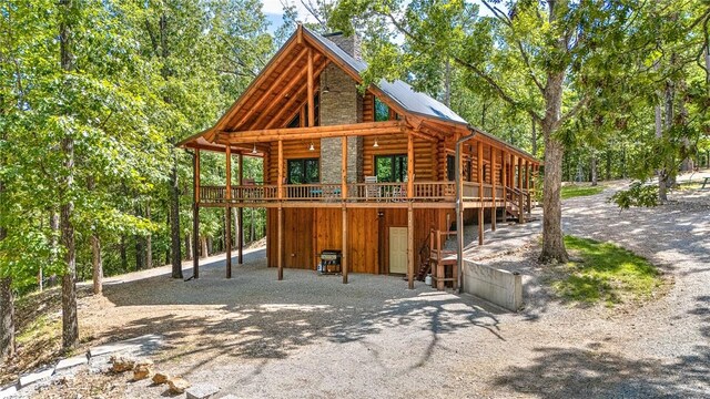 170 Meadow Ridge Rd, Eureka Springs, AR 72632 - rear view of property with log exterior, a deck, and driveway
