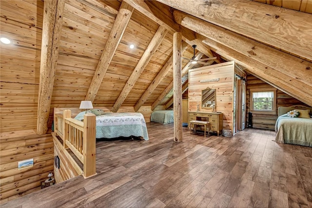 unfurnished bedroom with wooden ceiling, hardwood / wood-style flooring, wooden walls, and vaulted ceiling with beams