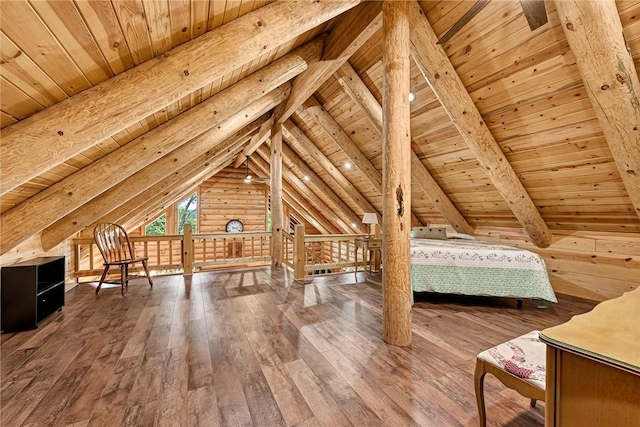 unfurnished bedroom with wooden ceiling, hardwood / wood-style flooring, vaulted ceiling with beams, and rustic walls