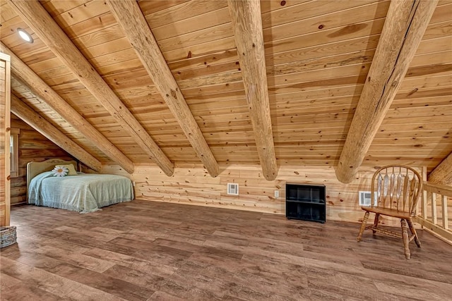 unfurnished bedroom featuring wood walls, vaulted ceiling with beams, wooden ceiling, and wood-type flooring