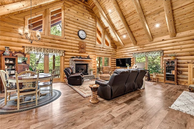170 Meadow Ridge Rd, Eureka Springs, AR 72632 - living area featuring high vaulted ceiling, wood ceiling with exposed beams, a chandelier, hardwood / wood-style floors, and log walls