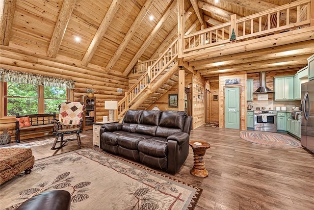 living room featuring log walls, wood ceiling, hardwood / wood-style floors, high vaulted ceiling, and beamed ceiling