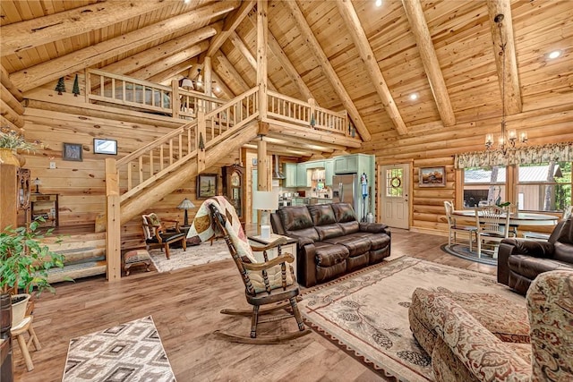 living room with wood ceiling, log walls, hardwood / wood-style floors, high vaulted ceiling, and beamed ceiling