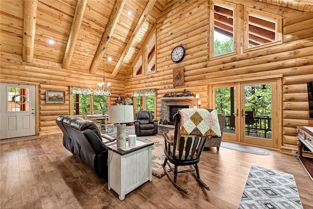 living room featuring beam ceiling, high vaulted ceiling, log walls, and a stone fireplace