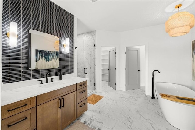 9188 Park Rd, Rogers, AR 72756 - full bathroom with vanity, marble finish floor, baseboards, a soaking tub, and a stall shower