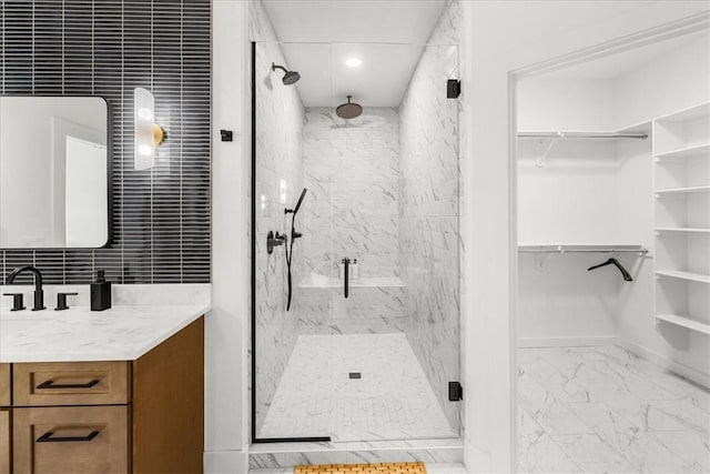 9188 Park Rd, Rogers, AR 72756 - full bath with a marble finish shower, a walk in closet, vanity, and marble finish floor