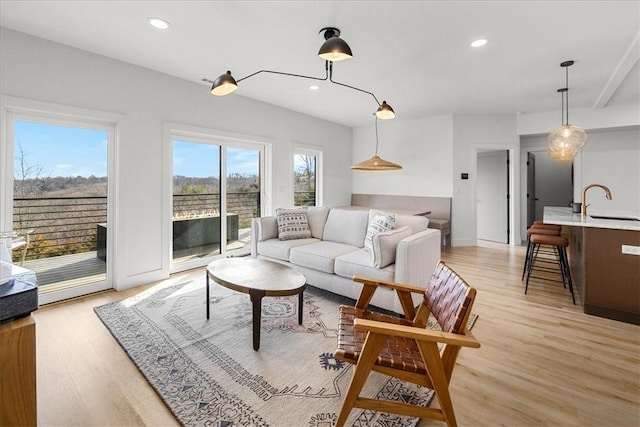 9188 Park Rd, Rogers, AR 72756 - living room featuring recessed lighting and light wood-style flooring