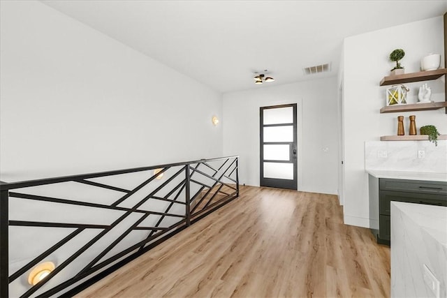 9188 Park Rd, Rogers, AR 72756 - interior space with light wood-type flooring, baseboards, and visible vents