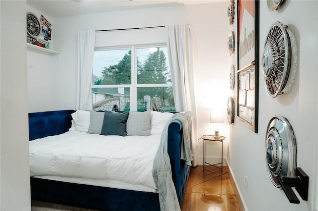 bedroom featuring light tile patterned flooring