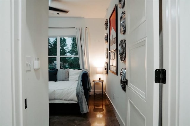 bedroom featuring ceiling fan and dark hardwood / wood-style flooring