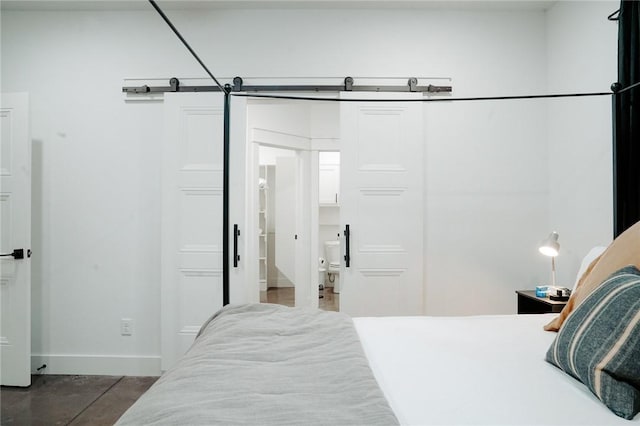 bedroom with a barn door