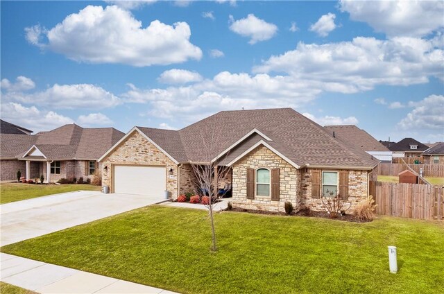 view of front facade featuring a front yard and a garage