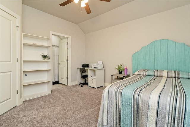 bedroom with ceiling fan, vaulted ceiling, and light colored carpet