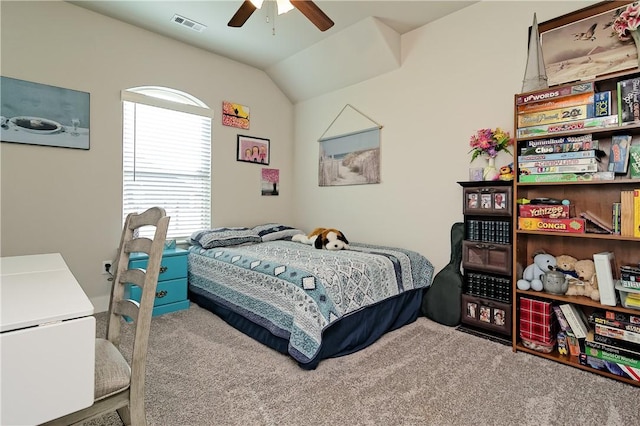 carpeted bedroom with lofted ceiling and ceiling fan