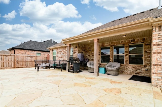 view of patio / terrace with an outdoor hangout area and a grill