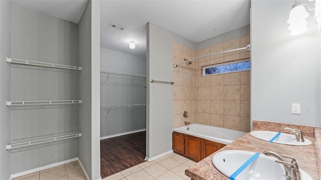 bathroom featuring tile patterned flooring and vanity