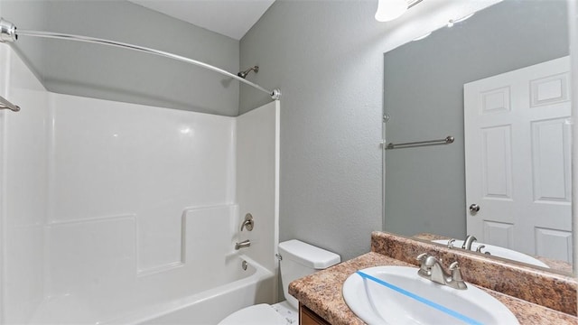 full bathroom featuring vanity, tub / shower combination, and toilet