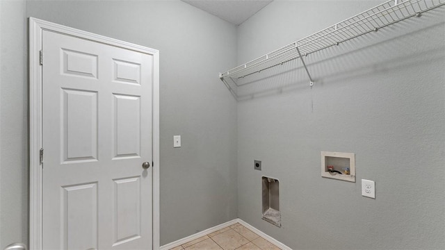 washroom with light tile patterned floors, hookup for a washing machine, and hookup for an electric dryer