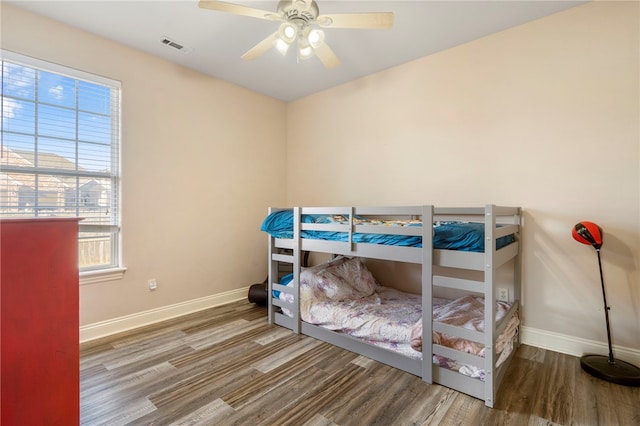 bedroom featuring hardwood / wood-style floors and ceiling fan