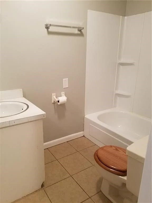 full bathroom featuring bathtub / shower combination, toilet, tile patterned floors, and vanity