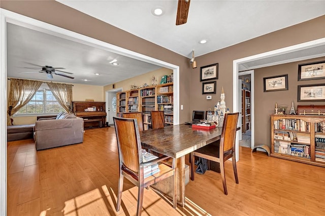 dining area featuring ceiling fan and hardwood / wood-style flooring