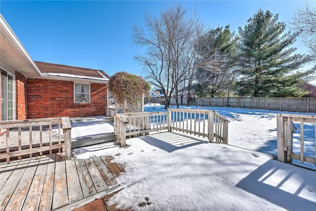 snow covered deck featuring a covered pool