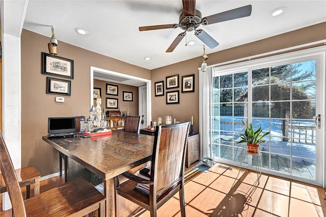 dining room featuring ceiling fan and light tile patterned flooring